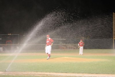 Cowboys take home opener 6-3 in front of capacity crowd In the top of the ninth, the sprinkler system came on. Luckily one of the coaches was on the job and cut off the sprinkler quickly. (Courier Photo: Bryon Garrison)